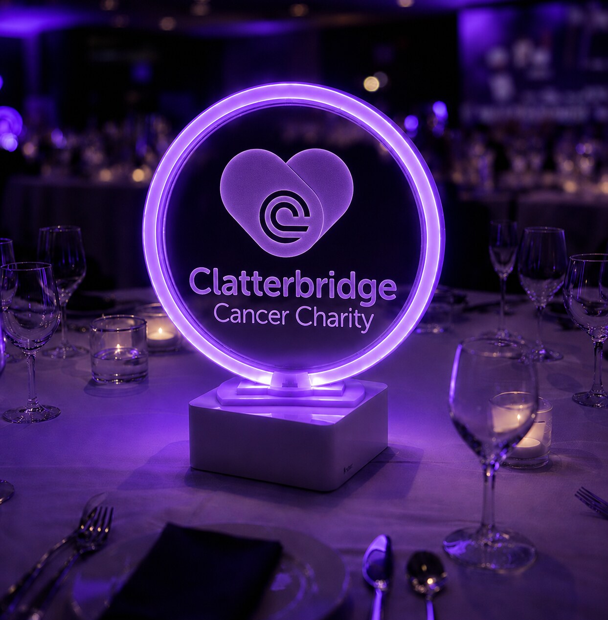 Illuminated Clatterbridge Cancer Charity branded heart-logo centrepiece