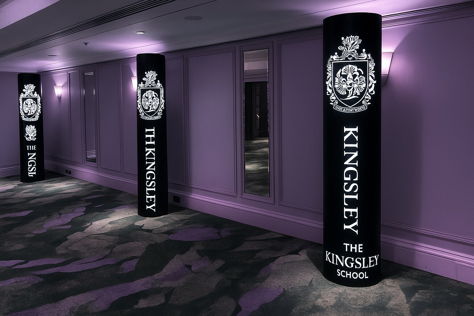 The Kingsley School crest branded entrance pillars in a corridor